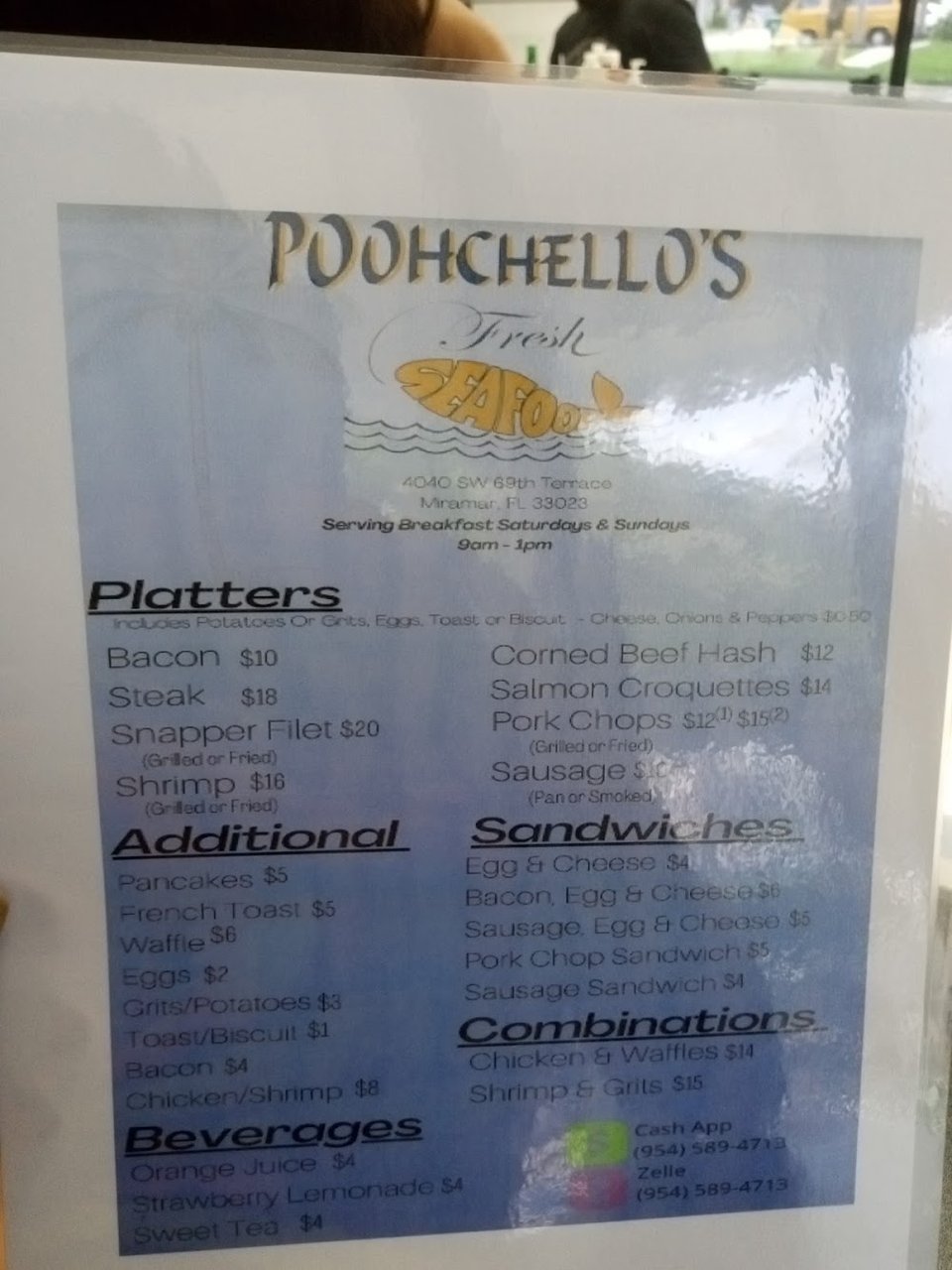 Printed menu showing seafood, pasta, and combo meals.